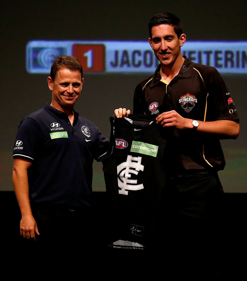 AFL 2015 Media - NAB AFL Draft ADELAIDE, AUSTRALIA - NOVEMBER 24: Number 1 draft pick Jacob Weitering is presented with his Carlton jumper during the NAB AFL Draft at the Adelaide Convention Centre, Adelaide, Australia on November 24, 2015. (Photo by Sean Garnsworthy/AFL Media)